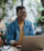 Young man studying at a cafe